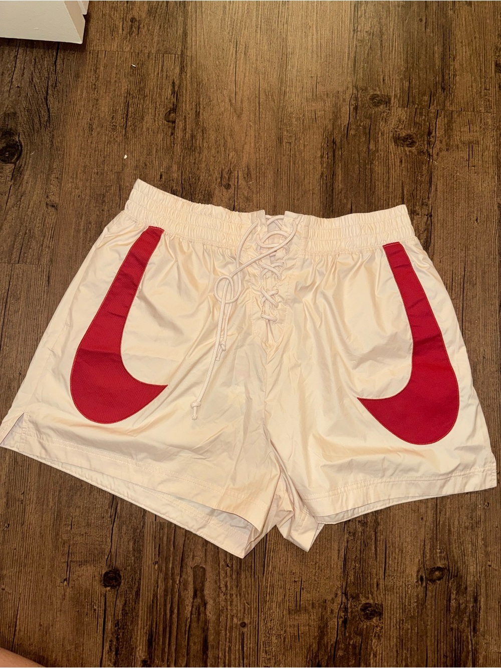 Nike White Women's Athletic Shorts with Red Swoosh Panels